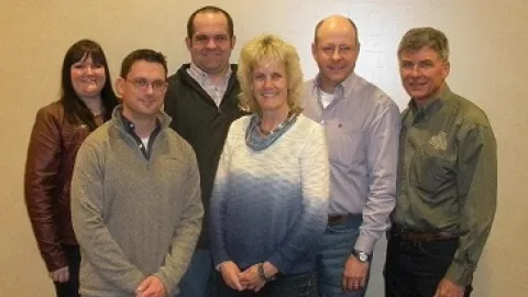 Group of people posing for a picture.